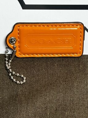 Coach Orange 2.5” Patent Leather Hangtag